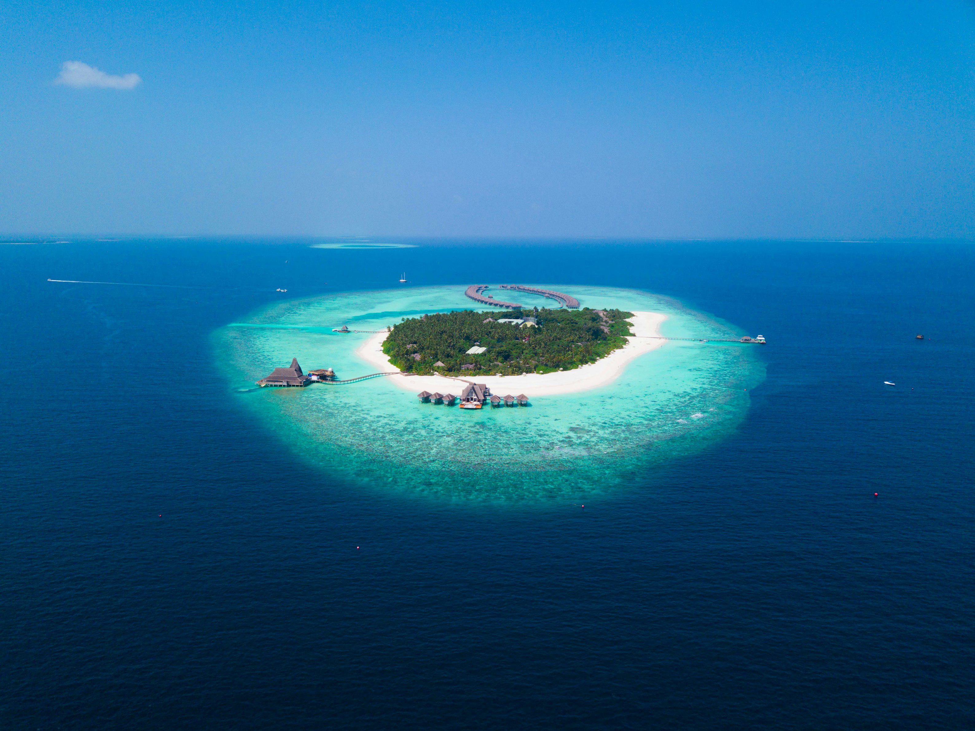 Aerial view of a private island with luxury villas
